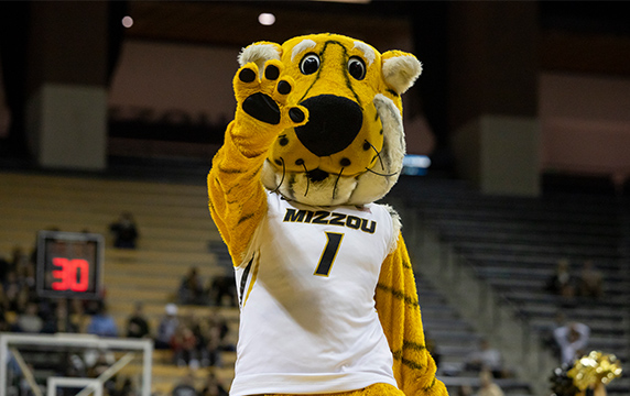 Photo of Truman the Tiger in a basketball jersey at a basketball game.